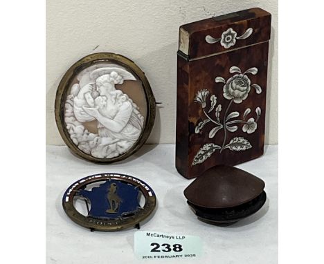 A 19th century tortoisehell and mother-of-pearl inlaid card case; a shell cameo brooch; a Japanese carved clam's dream netsuk