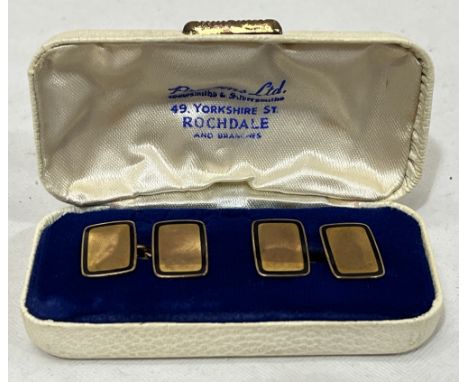 A pair of 9ct and enamel cufflinks. 6g