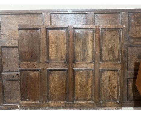 A quantity of 17th/18th century joined oak wall panelling in seven sections. 14m square approx.