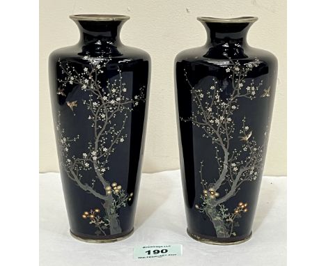 A pair of Japanese cloisonne enamel vases, decorated with birds and prunus. Meiji. 7" high. One with damage to rim