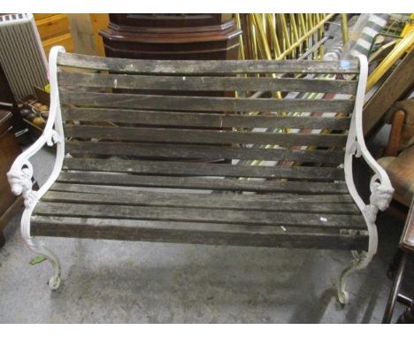 A white painted wrought iron and teak garden bench, 33 1/4"h x 51" w 