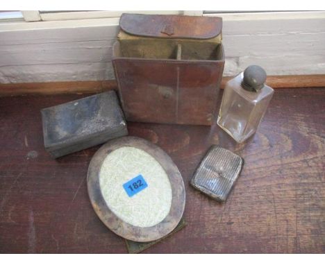 Silver and silver plate to include a silver plated sandwich box and a glass flask in a leather pouch, a silver oval photograp