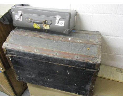 An early 20th century arched top trunk, together with a Globe Trotter case 