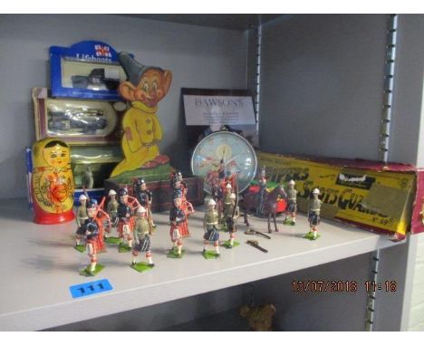 A mixed lot of vintage toys, to include toy soldiers 'Pipers of the Scots Guard' and Noddy clock 