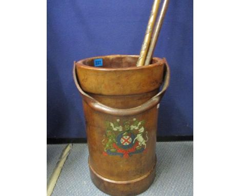 A reproduction leather shell case fashioned as a stick stand, together with three walking canes 