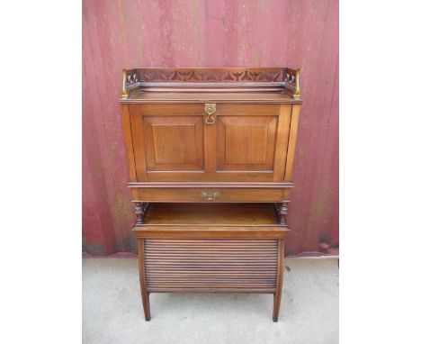 A Thomas Turner of Manchester late 19th century walnut desk, having a pierced gallery with cast, brass mounts, over a panelle