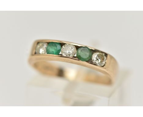 A 9CT GOLD EMERALD AND DIAMOND HALF ETERNITY RING, set with three round brilliant cut diamonds, estimated total diamond weigh