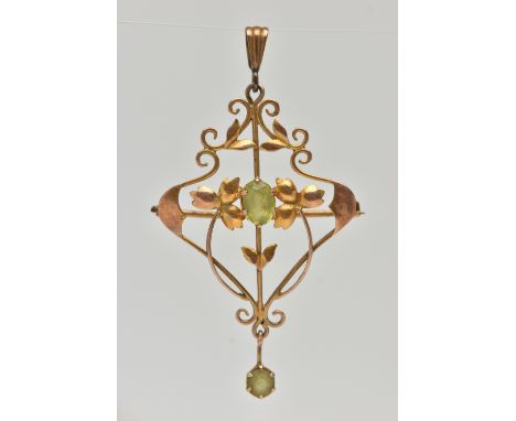 A YELLOW METAL PERIDOT SET LAVALIER PENDANT, open work floral pattern, set with a central oval cut peridot and a circular cut