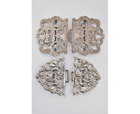 TWO SILVER NURSES BELT BUCKLES, the first of an open work scrolling design, hallmarked 'P M Ltd' Birmingham 1993, approximate