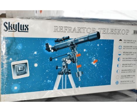 A BOXED 'SKYLUX' REFACTOR TELESCOPE, 70m f/7 on an equatorial mount and tripod, with instructions for use (1) (Condition Repo