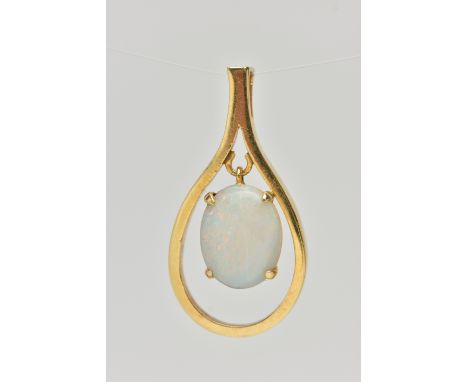 A YELLOW METAL OPAL CABCOHON PENDANT, open work tear drop shape pendant, set with a central oval cut white opal cabochon (cra