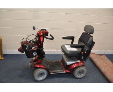 A ROMA MEDICAL CADIZ FOUR WHEELED MOBILITY SCOOTER with charger cover but no key (untested)