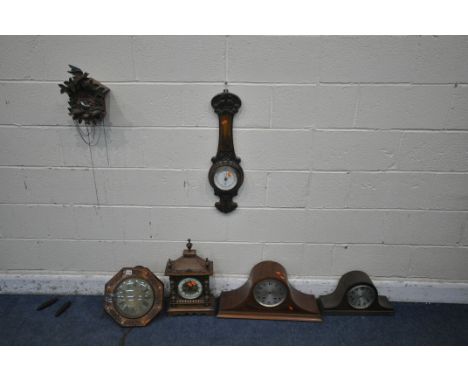 A 20TH CENTURY OAK MANTEL CLOCK, with three finials and brass mounts, another mantel clock, a mantel clock carcass, a cuckoo 