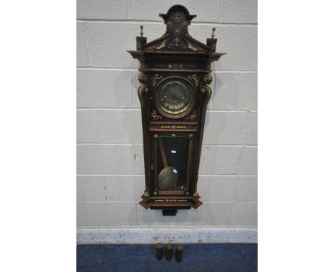 A 20TH CENTURY OAK CASED WALL CLOCK, with a variety of brass decorations, to include masks, ribbons, rams heads, etc., a circ
