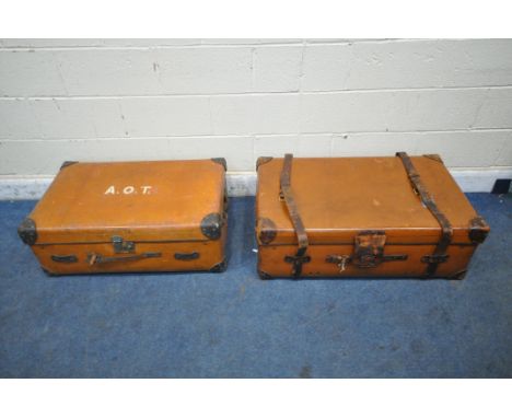 A LARGE TANNED LEATHER TRAVELING TRUNK, with twin handles and securing straps, width 93cm x depth 57cm x height 33cm, along w