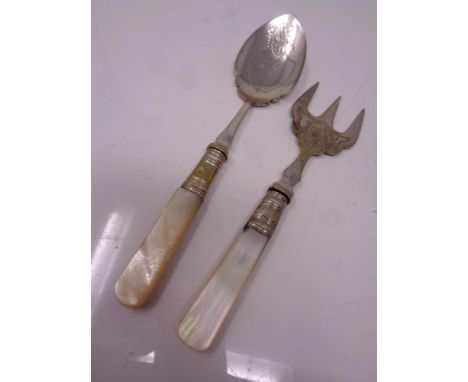 A mother of pearl handled spoon and fork 