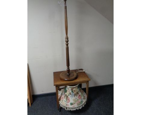 A mid 20th century teak turnover top trolley and a beech wood standard lamp with shade 