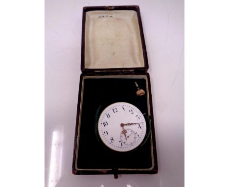 A vintage pocket watch face with winder in case 