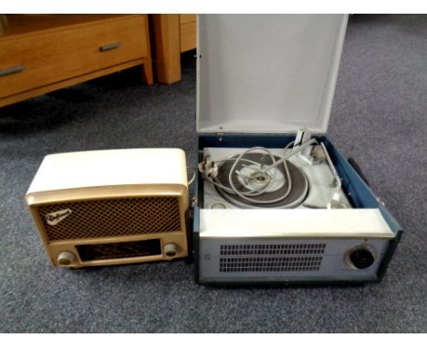 A mid century Philips portable electric record player together with a Bakelite cased Defiant radio 