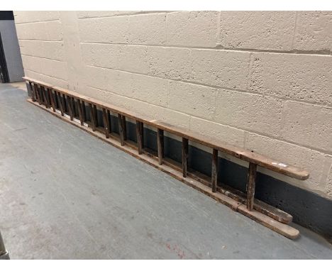 A wooden extension ladder 