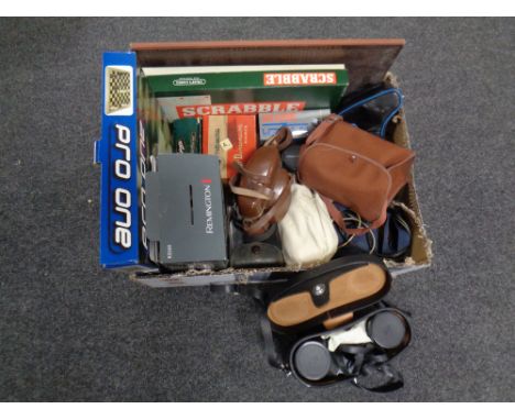 A box of cased binoculars, Remington shaver, board games, vintage cameras, viewmaster etc 