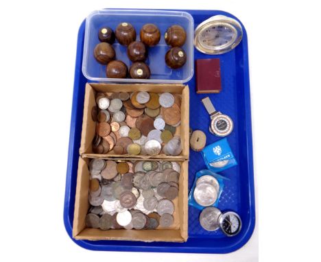 A tray of antique wooden carpet bowls, pre decimal and later coins, compass, desk clock.