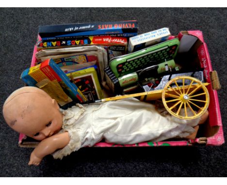 A box of vintage games and puzzles, Mattoy Super Type tin plate typewriter, vintage doll etc 