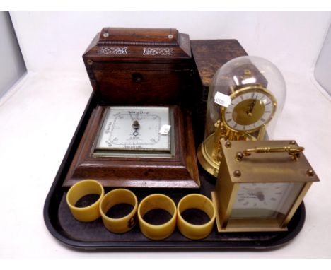 A tray of Regency rosewood and mother of pearl inlaid tea caddy, oak barometer, mantel clock, anniversary clock, four ivorine