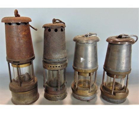Four miners lamps, the Wolf safety lamp (3) and one other 