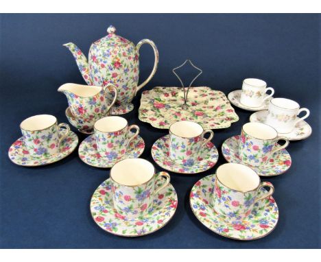 A collection of Royal Winton Old Cottage chintz coffee wares comprising coffee pot, cream jug, sugar bowl, six coffee cans an