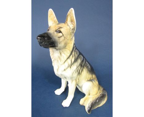 A Beswick fireside model of a seated German Shepherd dog, 34.5cm tall approx, with impressed mark and paper label to base 