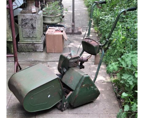 A vintage Atco Petrol Driven Cylinder Lawn Mower, with rear roller, 36cm cut, complete with grass box, manual and tool roll (