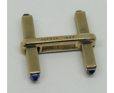 Single engine turned yellow metal cufflink with sapphire terminals, inscribed 'Asprey 1944', 3.9g 