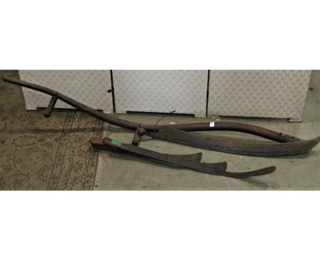 An antique agricultural scythe with stained ash wood handle and cast iron fitting stamped Universal Stourbridge, together wit