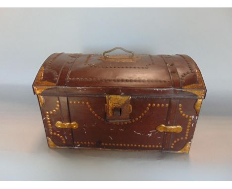 A painted tin box in the form of a studded leather trunk, 30cm wide