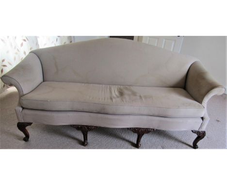 A Georgian style sofa, with arched back and scrolled arms, raised on six carved supports with shell and scroll detail, 2m wid