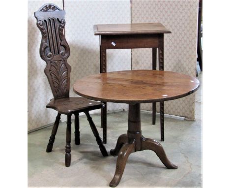 A Georgian oak low country made tripod table with circular top, together with an oak and stained beechwood spinning chair wit