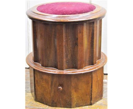 A Victorian mahogany commode of circular form with fluted panels, rising lid, ceramic chamber and step 