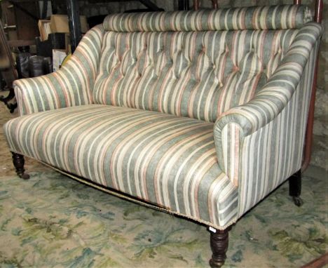 An Edwardian two seat drawing room/parlour sofa with rolled arms, shaped outline and later alternating striped upholstered fi