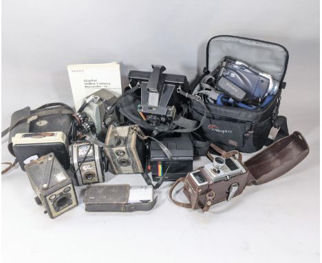 A box of vintage camera equipment (see attached inventory) including Polaroid, Coronet and Minolta pieces, as well as binocul