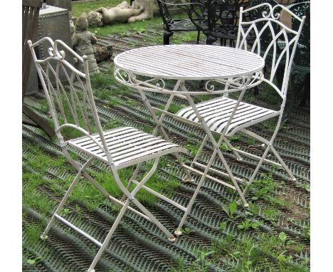 A contemporary cream painted light steel three piece terrace set comprising table with circular strap work top and simple rep