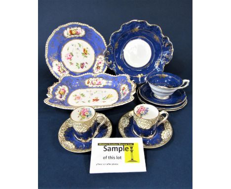 A collection of 19th century dessert wares with reserved floral panels on a blue ground, comprising a pair of rectangular ser