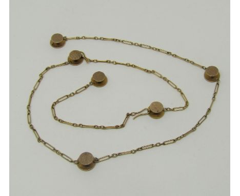 Yellow metal fancy link chain with six attached engine turned dress studs, 11.4g 