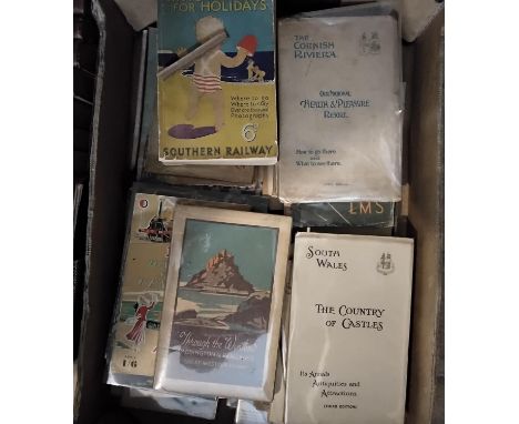 Two boxes containing a quantity of railway related books and vintage UK holiday guides produced by various rail companies (2)