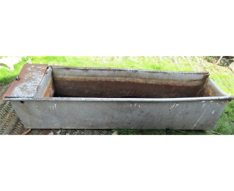 A reclaimed field water trough of rectangular form with tubular rim (af) approx 190cm long x 50cm wide x 40cm deep, together 