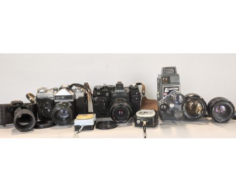 A number of vintage cameras including a Zenit-E 11, a Lumicon cine camera and film, a Hanimex automatic lens, etc 