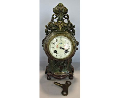 Late 19th century French painted spelter mantel clock, the casework with dolphin, floral, scroll and other detail, enclosing 