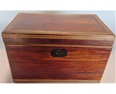 A good quality rosewood and parquetry inlaid tea caddy with simple ring handles and feather escutcheon, enclosing a twin lidd