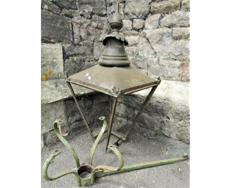 A Victorian copper lantern hood frame and associated wrought iron wall mounted/inserted bracket, the hood labelled William Su