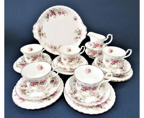 A collection of Royal Albert Lavender Rose pattern tea wares comprising milk jug, sugar bowl, cake plate, five cups, six sauc